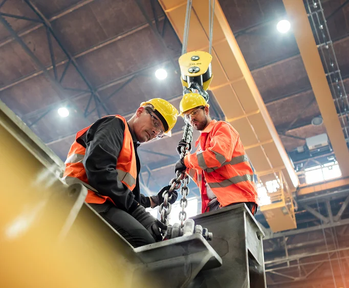 Industrial professionals working on site representing advisors helping clients avoid premature or misaligned business transition decisions